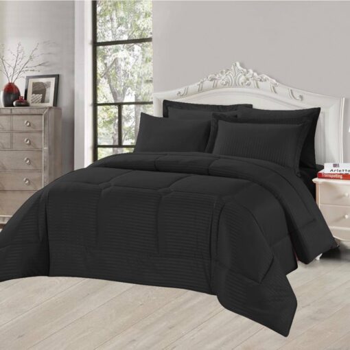 Black striped comforter set with matching pillow shams on a king-sized bed in a stylish bedroom with a white headboard and large window