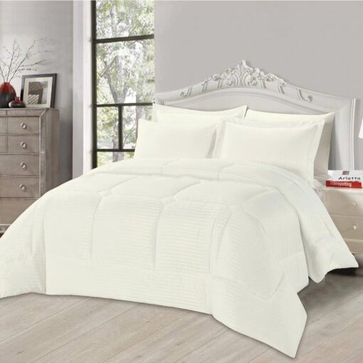 Off white striped comforter set with matching pillow shams on a king-sized bed in a stylish bedroom with a white headboard and large window