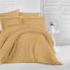 queen bed with orange stripe bed sheet and comforter on the bed adding a nice touch to the white room, stripe bed sheets and comforter set with four pillows